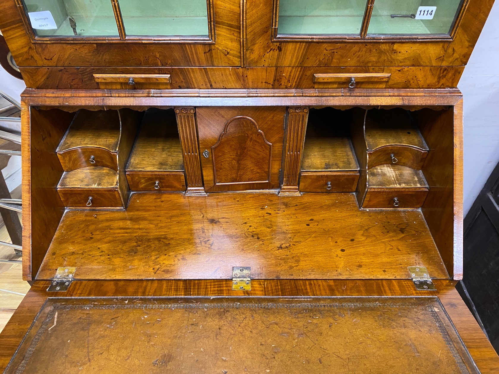 A George I style banded walnut double domed bureau bookcase, width 92cm, depth 55cm, height 214cm